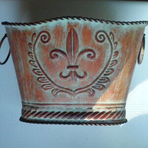 Ornate metal planter with design. Handles On Sides 8 1/2" Across 5 1/2" High 5"